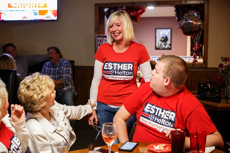 Tennessee House District 30 candidate Esther Helton, center, speaks with Justin Young, right, and Ruth Braly at an election returns party at 2503 Station Grill on Tuesday, Nov. 6, 2018, in Chattanooga, Tenn. 