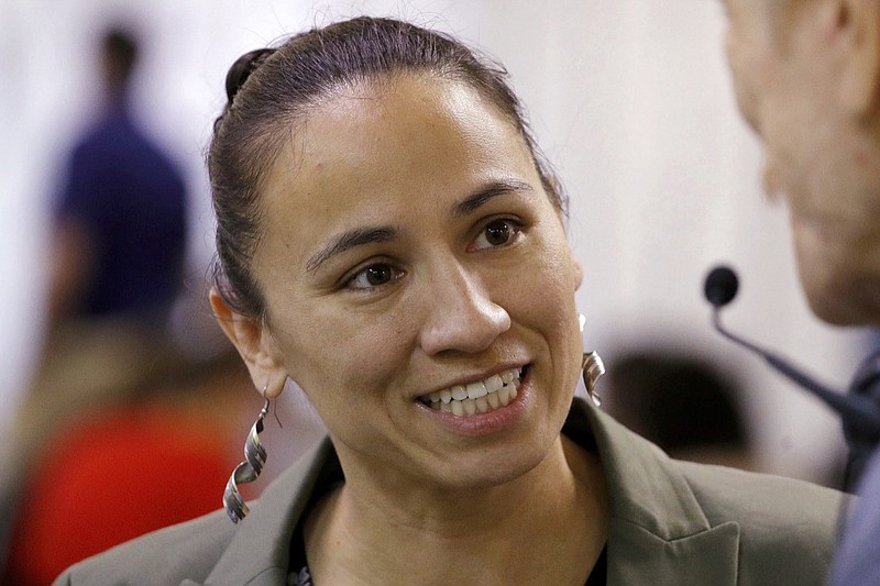 In this Oct. 1, 2018, file photo, Kansas Democratic Congressional candidate Sharice Davids talks to volunteer at her campaign office in Overland Park, Kan. Davids is challenging Republican incumbent Kevin Yoder in Kansas' 3rd District in the Nov. 6 election. (AP Photo/Charlie Riedel, File)