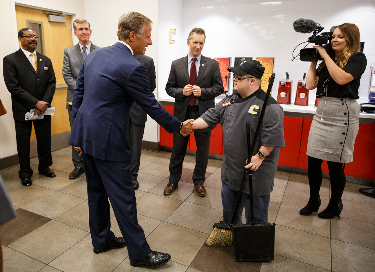 Gov. Bill Haslam shakes hands with worker Michael Decosimo during a visit to the campus of the University of Tennessee at Chattanooga on Thursday, Nov. 8, 2018, in Chattanooga, Tenn. Gov. Haslam released the fifth annual report by the Employment First Task Force during the visit, which shows the task force's efforts to increase employment for people with disabilities.