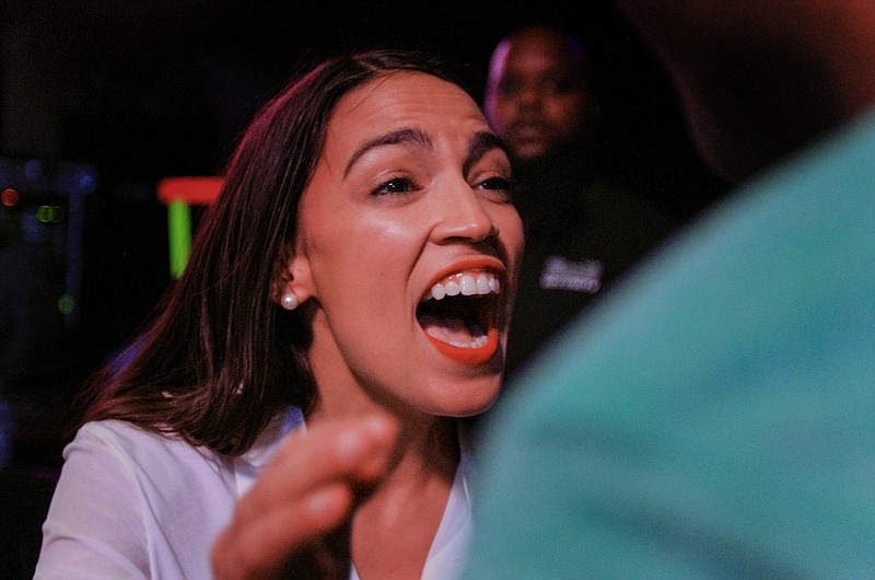 New York Democratic Congressional candidate Alexandria Ocasio-Cortez speaks to supporters, Tuesday, Nov. 6, 2018 in Queens the Queens borough of New York, after defeating Republican challenger Anthony Pappas in the race for the 14th Congressional district of New York. (AP Photo/Stephen Groves)

