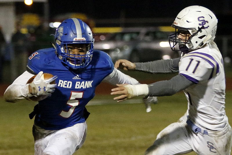 Red Bank's Calvin Jackson (5) tries to evade Sequatchie County's Skylar Mohler (11) during the second round of the TSSAA Class 3A playoffs at Red Bank Community Stadium on Friday, Nov. 9, 2018 in Red Bank, Tenn.
