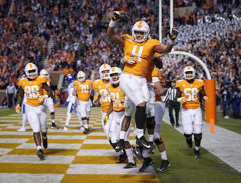 Tennessee tight end Dominick Wood-Anderson (4) celebrates after catching a touchdown pass from Jarrett Guarantano in the second half Saturday at Neyland Stadium. The Vols beat 12th-ranked Kentucky 24-7 to move within a game of bowl eligibility.