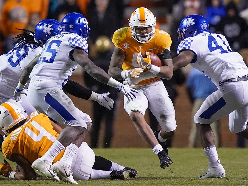 Tennessee's Tim Jordan finds a hole in the Kentucky defense during the fourth quarter Saturday at Neyland Stadium.