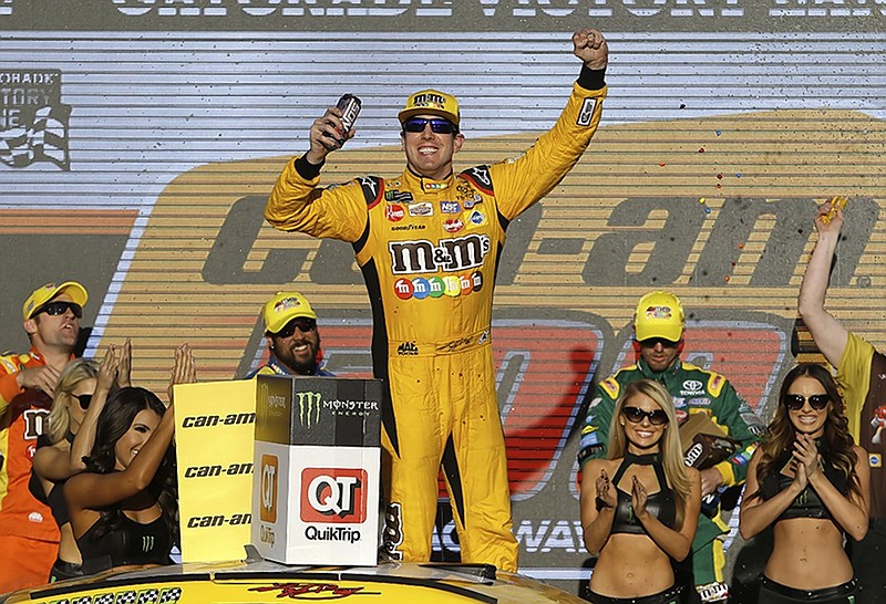 Kyle Busch celebrates after winning Sunday's NASCAR Cup Series race at ISM Raceway near Phoenix.