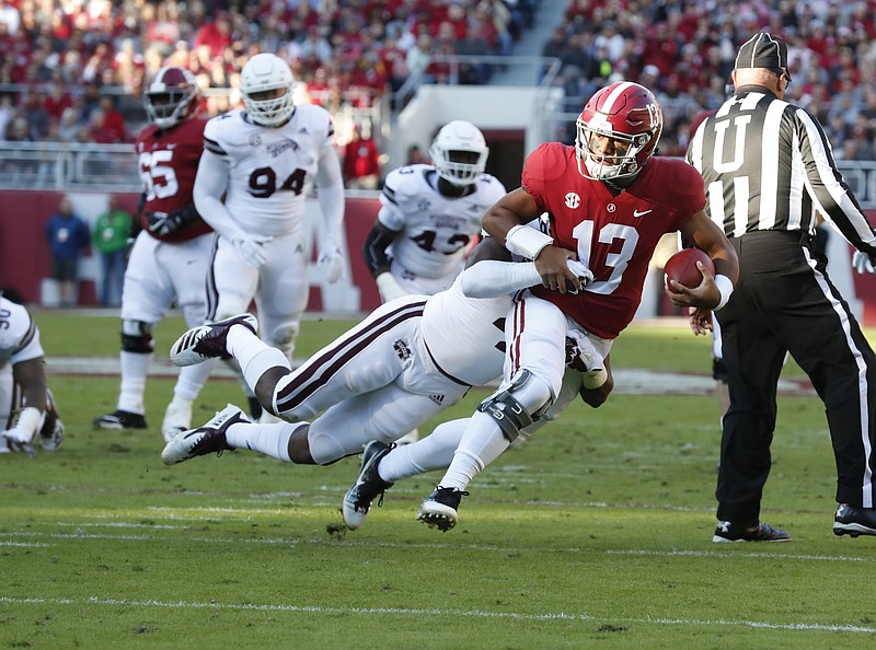 Alabama sophomore quarterback Tua Tagovailoa, who has battled an injured right knee for more than a month, runs for yardage during last Saturday's 24-0 win at Mississippi State.