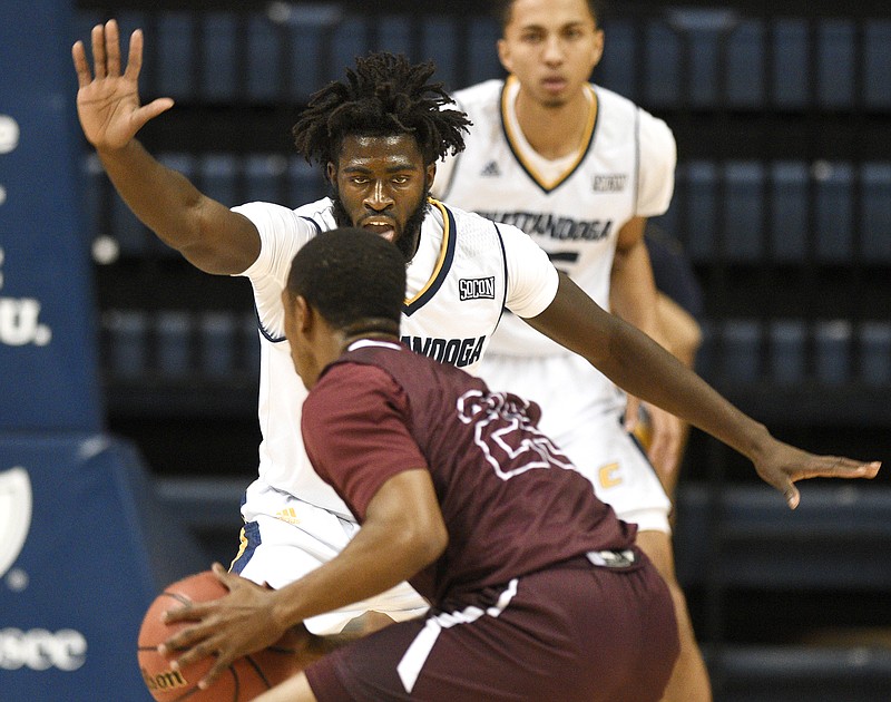 UTC's David Jean-Baptiste (3) defends Cumberland's Roddarius Pitts (23).  The Chattanooga Mocs hosted the Cumberland Phoenix in men's basketball action at McKenzie Arena on November 13, 2018.  