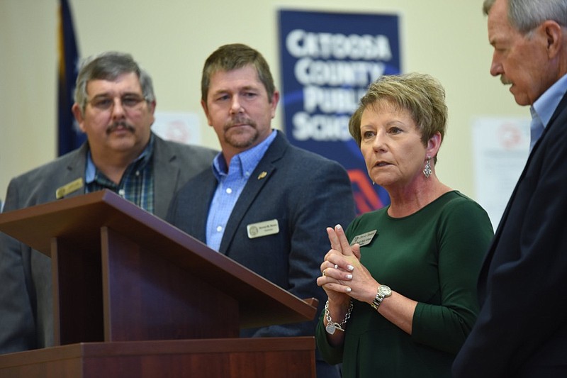Denia Reese, Superintendent for Catoosa County Schools, announces a homestead tax exemption on property taxes for seniors in Catoosa County Thursday at the Catoosa County Board of Education. Standing from left are, Catoosa Commissioner Jeff Long, Catoosa County Commission Chairman Steven Henry, Reese and Catoosa County Schools Board Chairman Don Dycus.