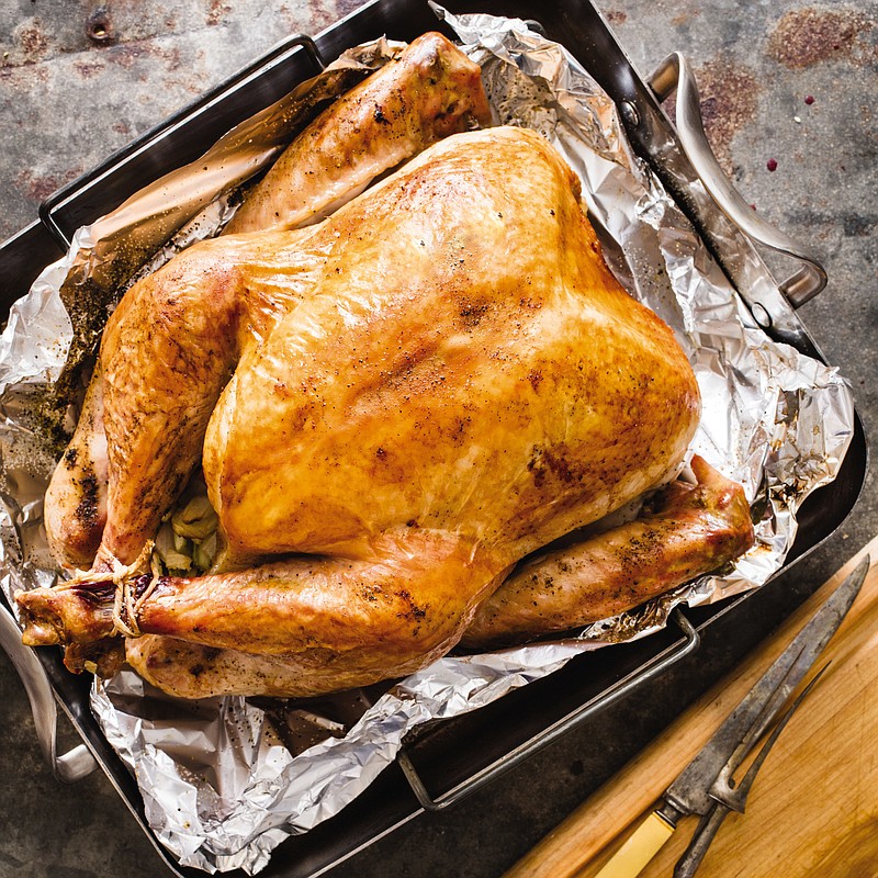 This undated photo provided by America's Test Kitchen in October 2018 shows a roast turkey in Brookline, Mass. This recipe appears in the cookbook “ATB Holiday Entertaining.” (Daniel J. van Ackere/America's Test Kitchen via AP)