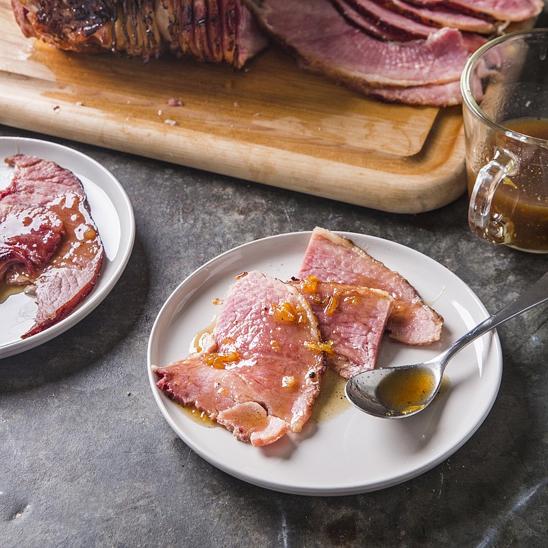 This undated photo provided by America's Test Kitchen in October 2018 shows glazed spiral-sliced ham in Brookline, Mass. This recipe appears in the cookbook "All-Time Best Holiday Entertaining." (Joe Keller/America's Test Kitchen via AP)