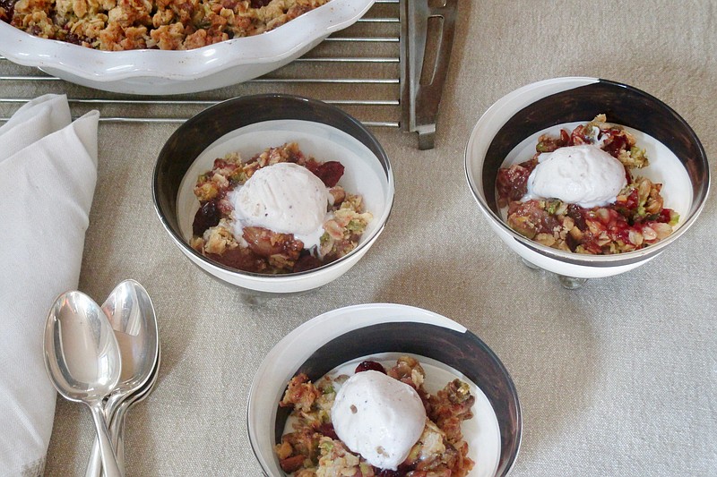 This Oct. 25, 2018 photo shows bowls of grape and cranberry crisps in New York. This dish is from a recipe by Sara Moulton. (Sara Moulton via AP)