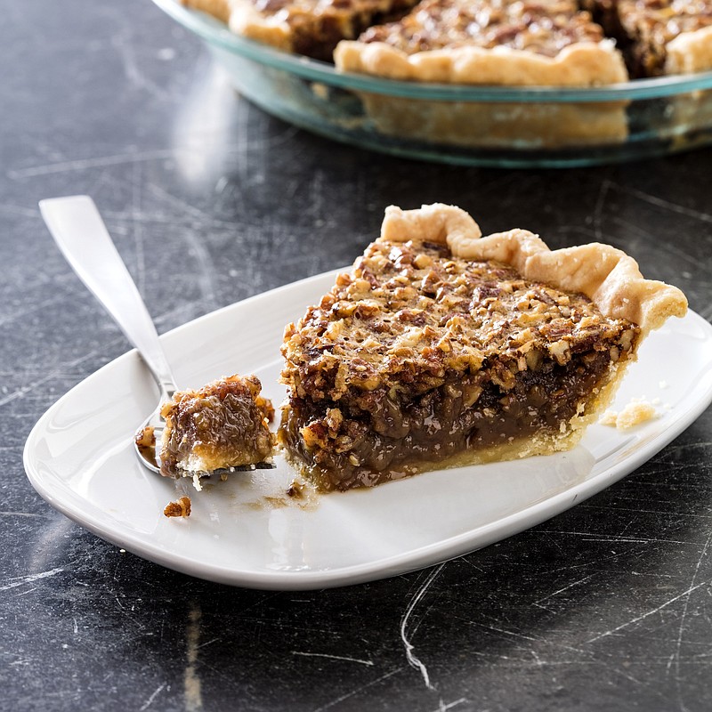 This undated photo provided by America's Test Kitchen in October 2018 shows classic pecan pie in Brookline, Mass. This recipe appears in the cookbook “All-Time Best Holiday Entertaining.” (Daniel J. van Ackere/America's Test Kitchen via AP)