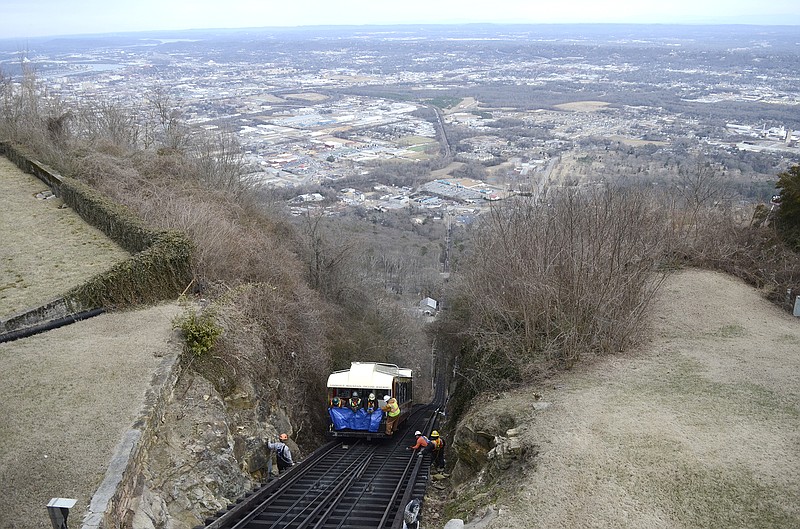 A crew from American Track Generations replaces cross ties Thursday on the tracks near the top of the Incline Railway on Lookout Mountain. The work has been going on for the last 14 days, and CARTA hopes to reopen the Incline on Monday. 