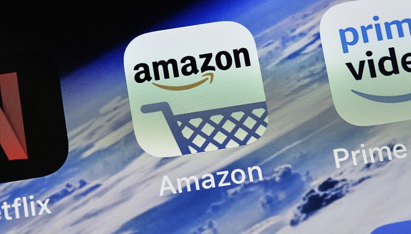 The icon of Amazon is pictured on an iPhone. (AP Photo/Martin Meissner)