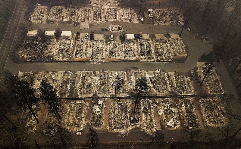 Residences were leveled by the wildfire in Paradise, Calif., on Thursday, Nov. 15, 2018. The California Department of Forestry and Fire Protection said Thursday the wildfire that destroyed the town of Paradise is now 40 percent contained, up from 30 percent Wednesday morning. (AP Photo/Noah Berger)

