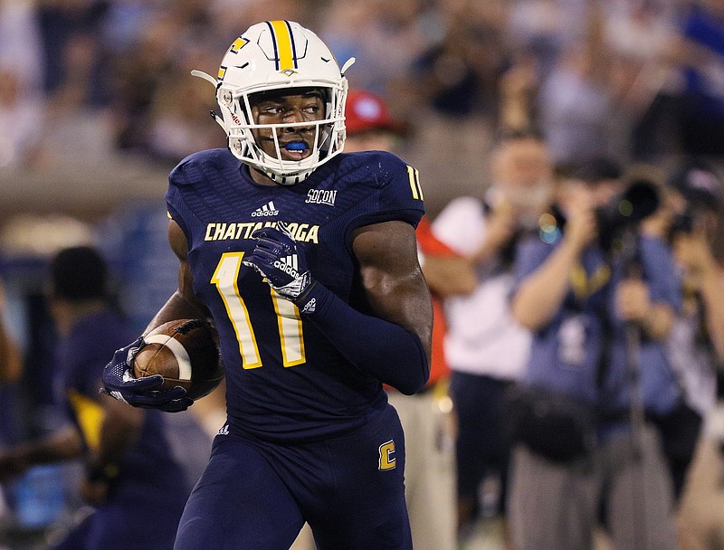 UTC receiver Wil Young heads for the end zone with a touchdown catch during the Mocs' season opener against Tennessee Tech on Aug. 30 at Finley Stadium. Young and the Mocs will close their 2018 schedule today with a game at South Carolina.