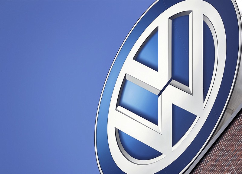 In this Wednesday, Aug. 1, 2018, file photo, the logo of Volkswagen is seen on top of a company building in Wolfsburg, Germany. German automaker Volkswagen. says it will invest 44 billion euros ($50 billion) in developing autonomous and electric cars. (AP Photo/Michael Sohn, file)