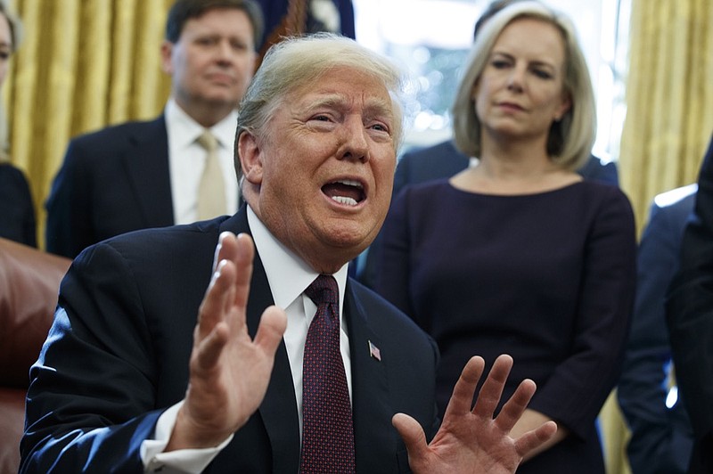 President Donald Trump answers a reporters question about the investigation of special counsel Robert Mueller during a signing ceremony of the "Cybersecurity and Infrastructure Security Agency Act," in the Oval Office of the White House, Friday, Nov. 16, 2018, in Washington. (AP Photo/Evan Vucci)

