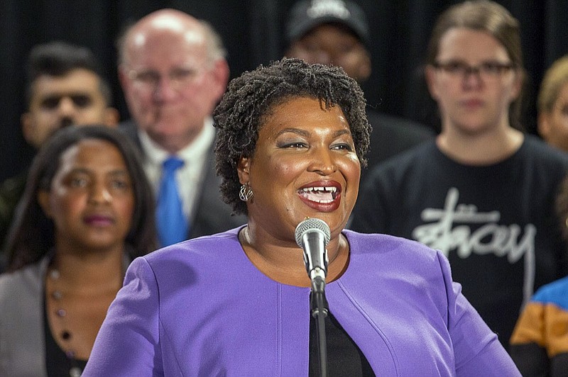 Georgia gubernatorial candidate Stacey Abrams makes remarks during a press conference at the Abrams Headquarters in Atlanta, Friday, Nov. 16, 2018. Democrat Stacey Abrams says she will file a federal lawsuit to challenge the "gross mismanagement" of Georgia elections. Abrams made the comments in a Friday speech, shortly after she said she can't win the race, effectively ending her challenge to Republican Brian Kemp. (Alyssa Pointer/Atlanta Journal-Constitution via AP)

