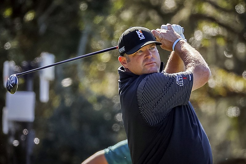 Jason Gore watches his tee shot on the second hole of the Seaside Course at Sea Island Resort during Saturday's third round of the PGA Tour's RSM Classic.