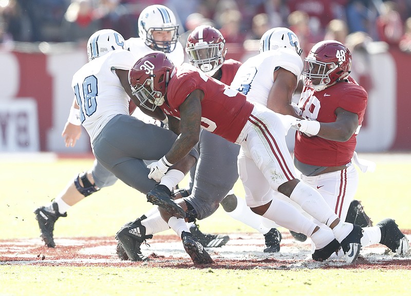 Alabama junior inside linebacker Mack Wilson (30) tackles The Citadel's Dante Smith, who stunned the Crimson Tide with nine rushes for 130 yards and two touchdowns Saturday afternoon. The game was tied 10-10 at halftime, but Alabama pulled away after that for a 50-17 victory to improve to 11-0.