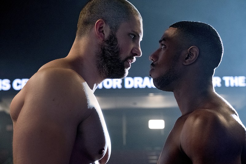 This image released by Metro Goldwyn Mayer Pictures / Warner Bros. Pictures shows Florian Munteanu , left, and Michael B. Jordan in a scene from "Creed II."  (Barry Wetcher/Metro Goldwyn Mayer Pictures/Warner Bros. Pictures via AP)