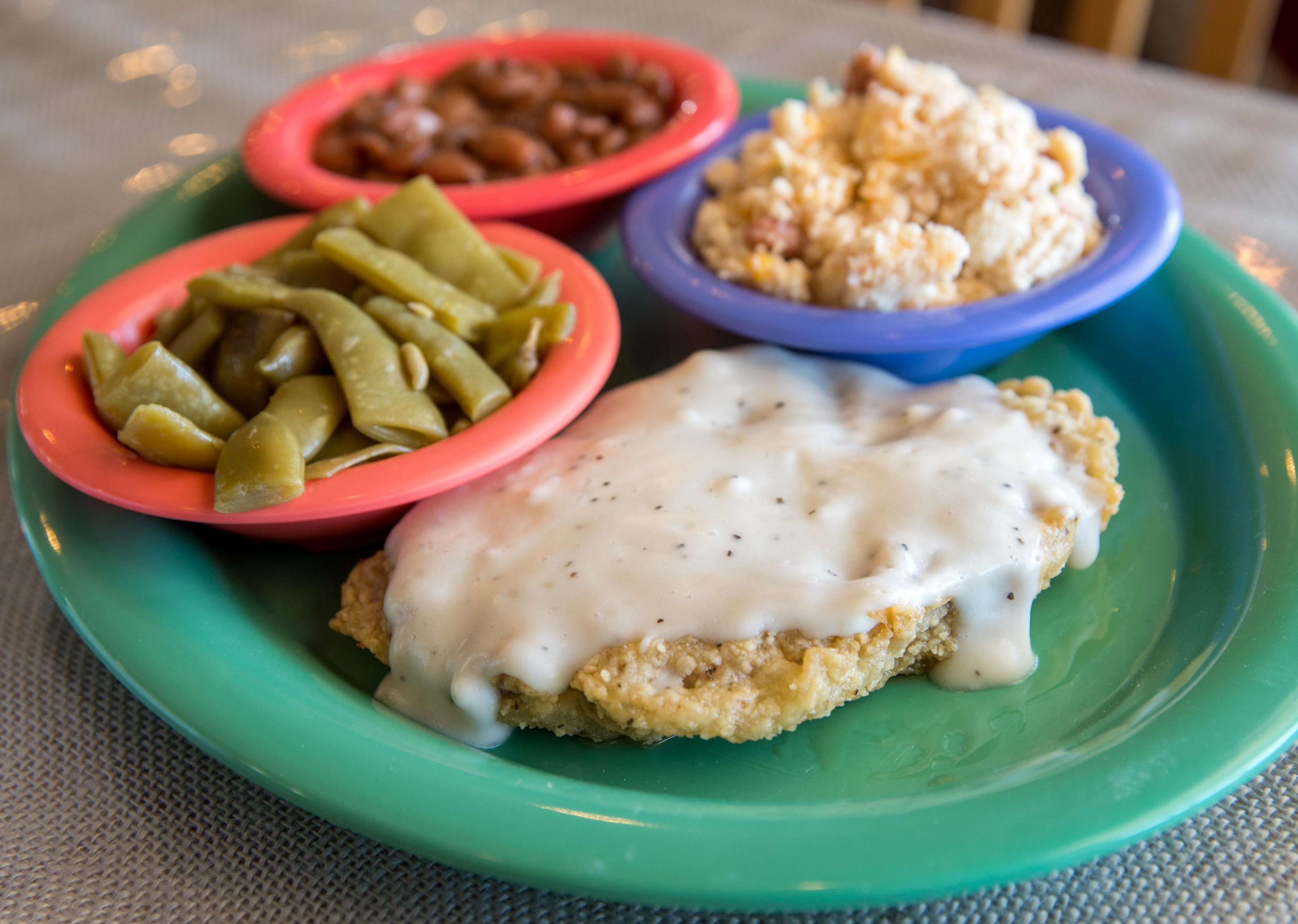 Cookie Jar Cafe's country fried steak, served with two to three scratch-made sides.