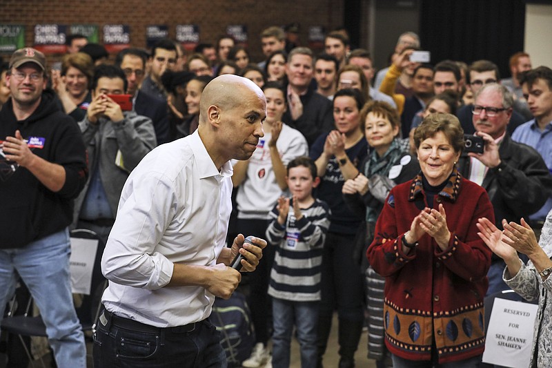 In this Oct. 28, 2018, file photo, Sen. Cory Booker of New Jersey exits the stage after speaking at a get out the vote event hosted by the New Hampshire Young Democrats at the University of New Hampshire in Durham. Even before they announce their White House intentions, New Hampshire's ambitious neighbors are in the midst of a shadow campaign to shape the nation's first presidential primary election of the 2020 season.(AP Photo/ Cheryl Senter, File)