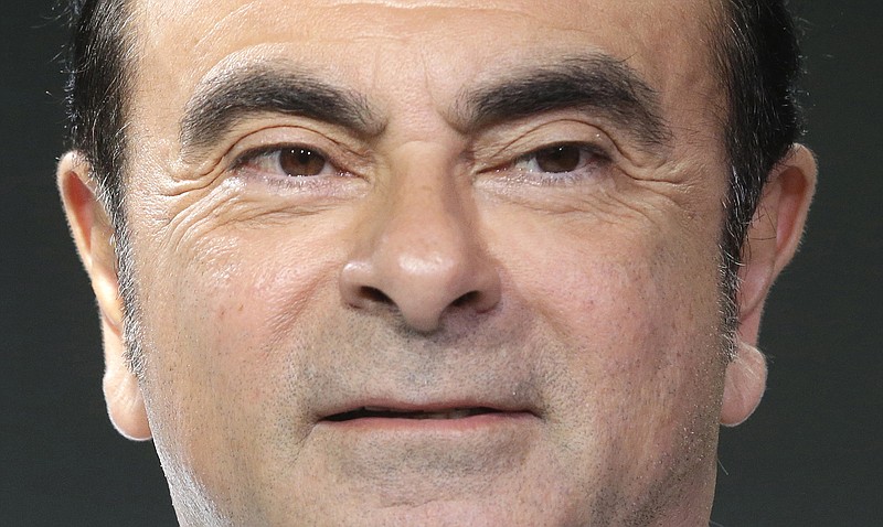 FILE - In this Feb. 16, 2016, file photo, Chairman and CEO of Renault and Nissan Motor Co.'s Carlos Ghosn poses during the presentation in Monaco. Nissan Motor Co. says an internal investigation found that its chairman Ghosn has underreported his income and will be dismissed. (AP Photo/Lionel Cironneau/File)