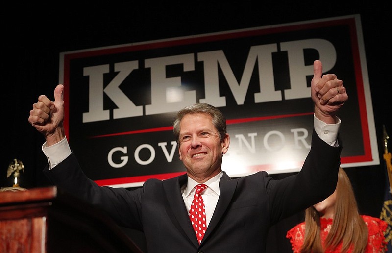 In a Nov. 7, 2018, file photo, Georgia Republican gubernatorial candidate Brian Kemp gives a thumbs-up to supporters, in Athens, Ga. Georgia governor-elect Brian Kemp on Monday, Nov. 19, 2018 unveiled a transition team that includes former U.S. Health and Human Services Secretary Tom Price to begin building out his administration. (AP Photo/John Bazemore, File)