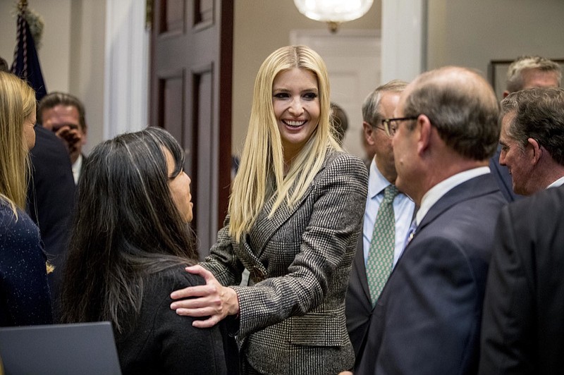 In this Nov. 14, 2018, photo, Ivanka Trump, the daughter of President Donald Trump, center, greets guests after President Donald Trump spoke about prison reform in the Roosevelt Room of the White House in Washington. Ivanka Trump, the president's daughter and adviser, sent hundreds of emails about government business from a personal email account last year. That's according to the Washington Post, which reports the emails were sent to other White House aides, Cabinet officials and her assistants. (AP Photo/Andrew Harnik)

