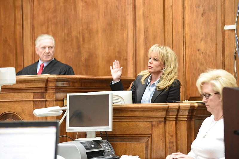 In this May 8, 2015, staff file photo, Judge Grant Brantley, left, watches the swearing in of witness Angela Russell Friday inside the Catoosa County Courthouse.