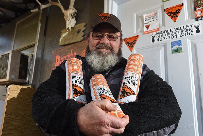 Bob Winder holds 2-pound packs of venison burger meat packaged for Hunters for the Hungry, a program in partnership with the Tennessee Wildlife Federation.