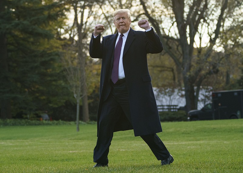 President Donald Trump gestures as he walks to Marine One after speaking to media at the White House in Washington on Tuesday for the short trip to Andrews Air Force Base en route to Palm Beach International Airport, in West Palm Beach, Fla., and on to and onto Mar-a-Lago. (AP Photo/Carolyn Kaster)