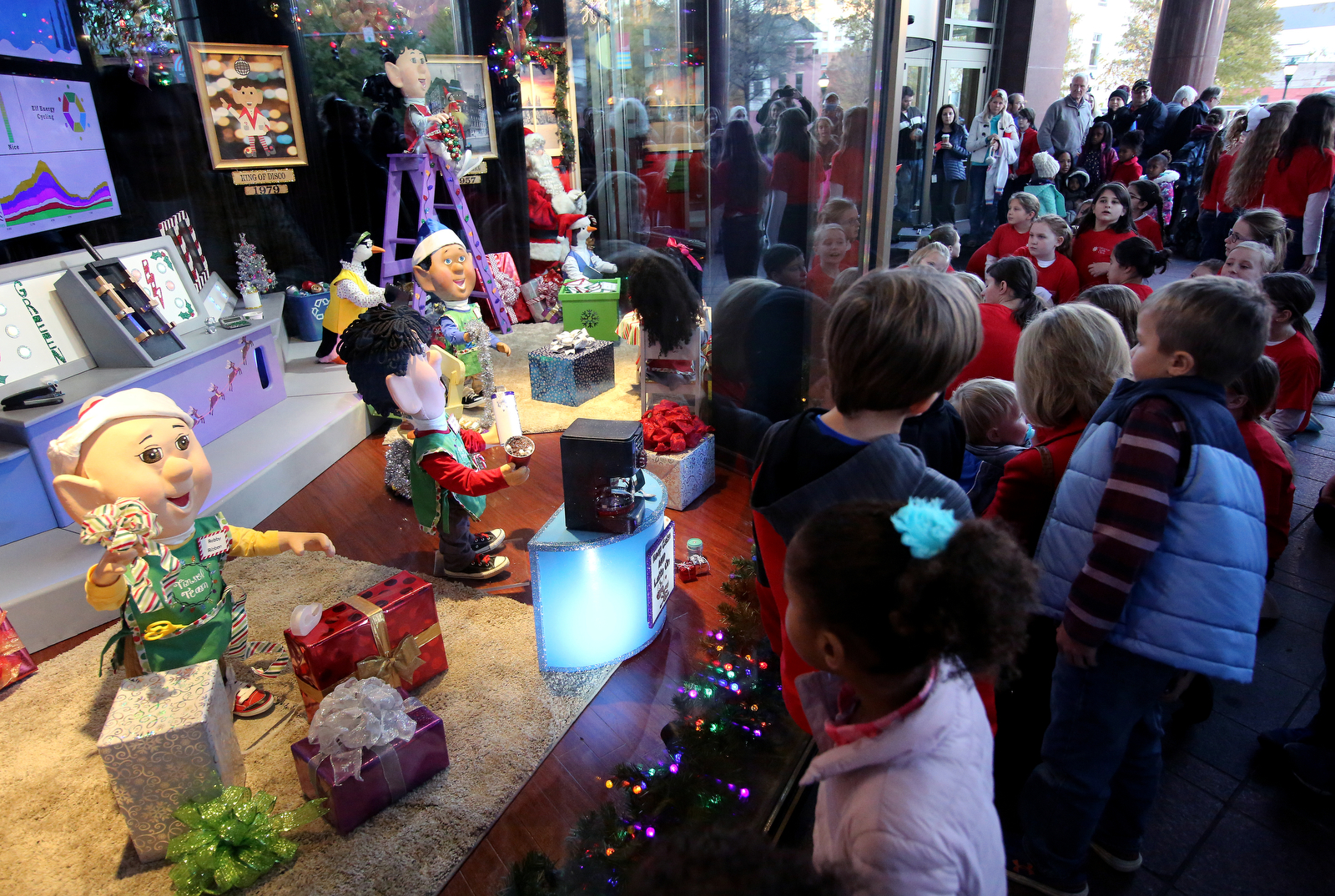 Kids check out the Holiday Window display during EPB's revealing event Wednesday, November 21, 2018 in Chattanooga, Tennessee. The EPB Holiday Windows will remain on display through January 1.