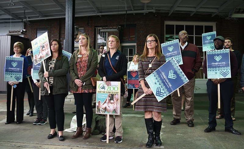 People hold signs during the Cha Gives kickoff announcement Tuesday, Nov. 15, 2016 at the Chattanooga Choo Choo. CHA Gives Day will be Tuesday, November 29, 2016.