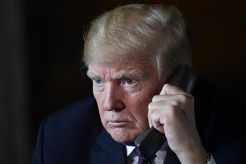 President Donald Trump talks with troops via teleconference from his Mar-a-Lago estate in Palm Beach, Fla., Thursday, Nov. 22, 2018. (AP Photo/Susan Walsh)