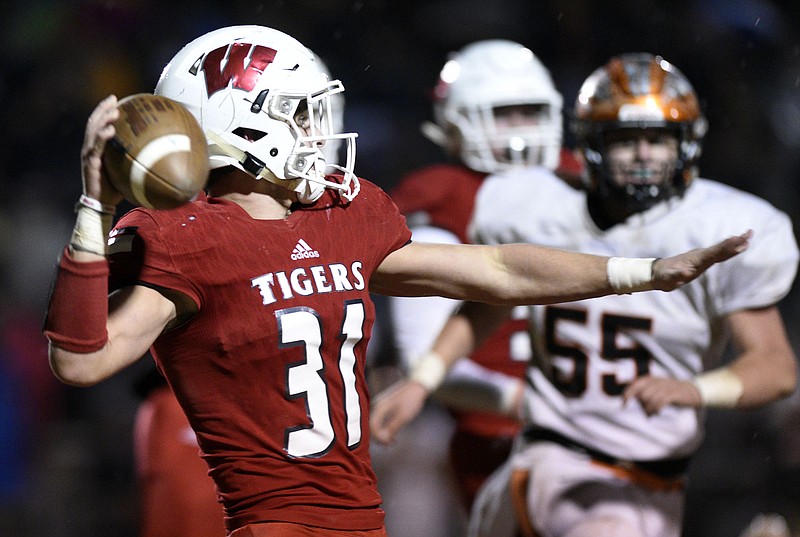 Whitwell's Hudson Petty throws a pass to Trenton Stockwell, not pictured, during the Tigers' state semifinal victory against visiting Greenback on Nov. 23. The Tigers will take on Cornersville — both teams are 14-0 — in the TSSAA Class 1A title game today at Tennessee Tech in Cookeville.