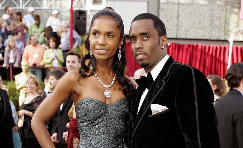 FILE - In a Feb. 27, 2005 file photo, Sean "P. Diddy" Combs arrives with date, Kim Porter, for the 77th Academy Awards in Los Angeles. Sean "Diddy" Combs on Sunday, Nov. 18, 2018 is making his first public statements since the loss of longtime former girlfriend and mother of three of his children Kim Porter, saying they were "more than best friends," and "more than soul mates." Porter, a former model and actress, died in her home Thursday, Nov. 15 at age 47. (AP Photo/Amy Sancetta, File)

