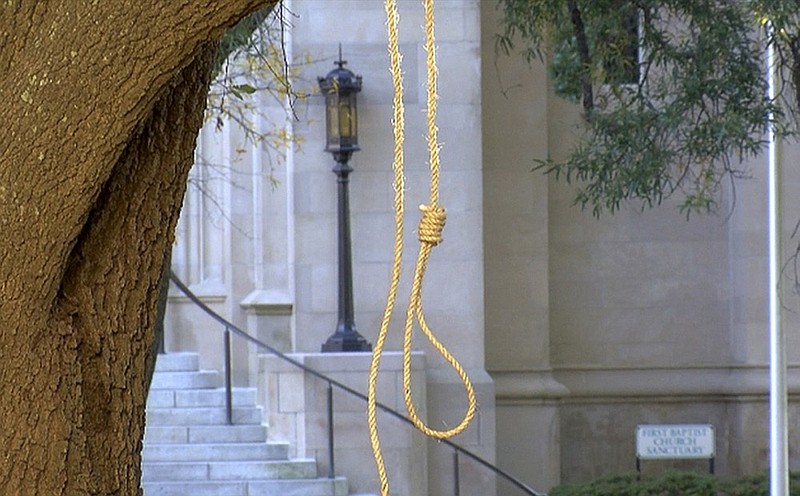 In this photo provided by WLBT-TV a noose hangs on a tree on the state capitol grounds in Jackson, Miss. on Monday, Nov. 26, 2018. A Mississippi official says two nooses and six signs were found on the grounds of the Mississippi state Capitol. Chuck McIntosh, a spokesman for the Mississippi Department of Finance and Administration, which oversees the Capitol, says the nooses and signs were found Monday morning between 7:30 a.m. and 8 a.m. (WLBT-TV via AP)

