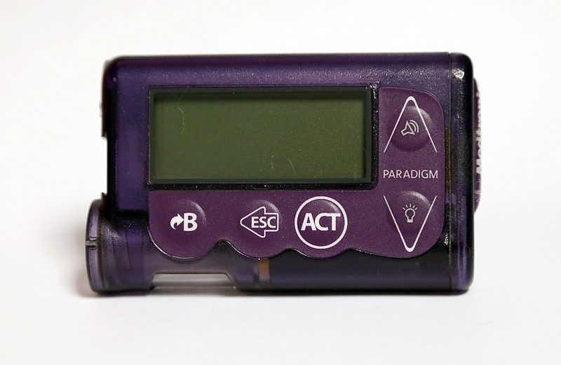 This Nov. 14, 2018 photo taken in Jackson, Miss., shows the Medtronic Paradigm REAL-Time Revel insulin pump of Polly Varnado's daughter. Medical device manufacturers and experts say insulin pumps are safe. But an AP investigation found that insulin pumps and their components are responsible for the highest number of malfunction, injury and death reports in the U.S. Food and Drug Administration’s medical device database. (AP Photo/Rogelio V. Solis)