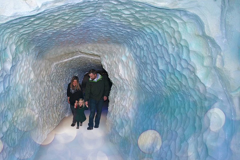 A glittering ice cave leads to a visit with Santa.