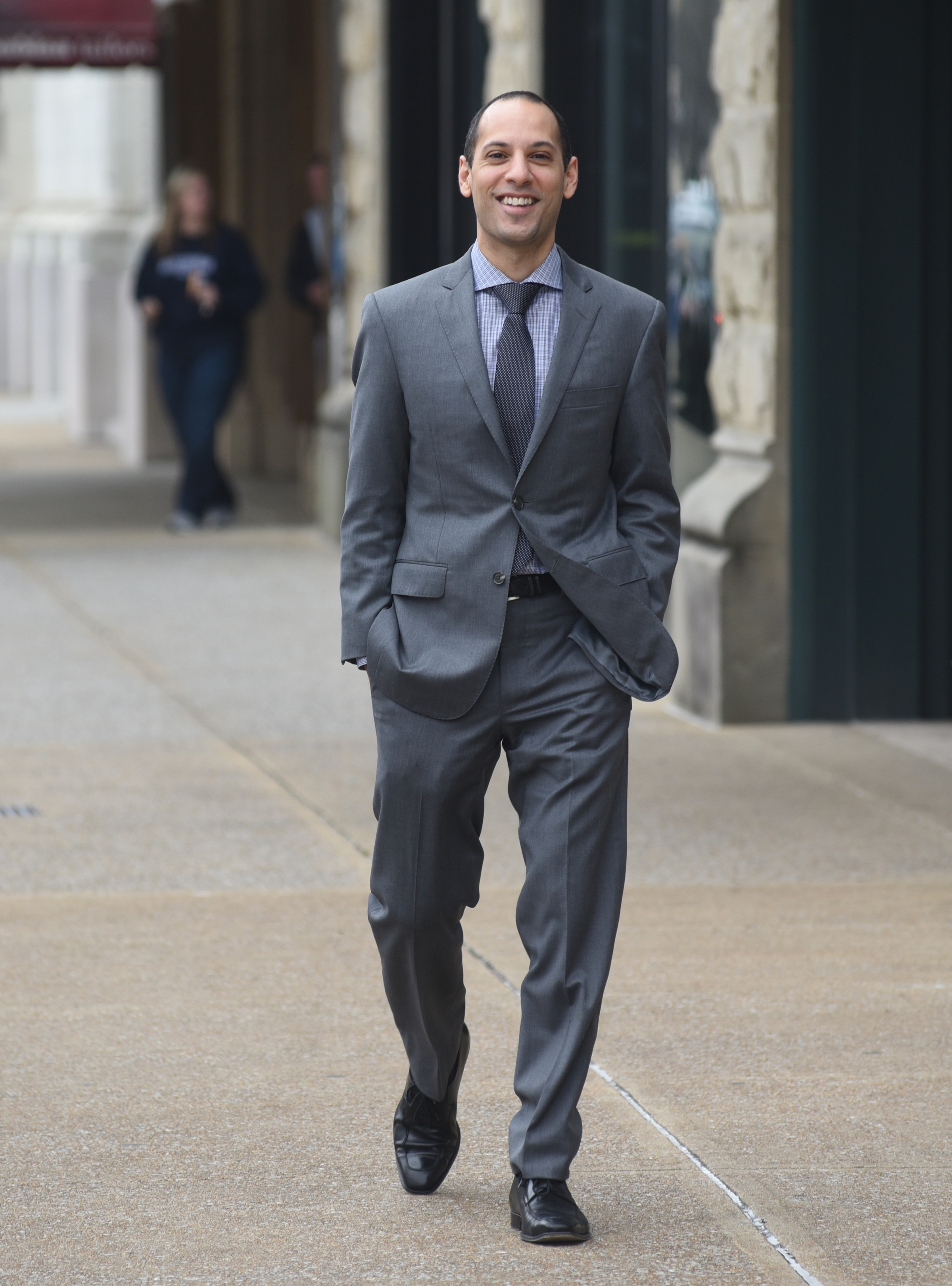 Hovic Yacoubian, store manager at Yacoubian Tailors, wears a basic grey suit in the latest style Tuesday, Feb. 10, 2015, in Chattanooga, Tenn.
