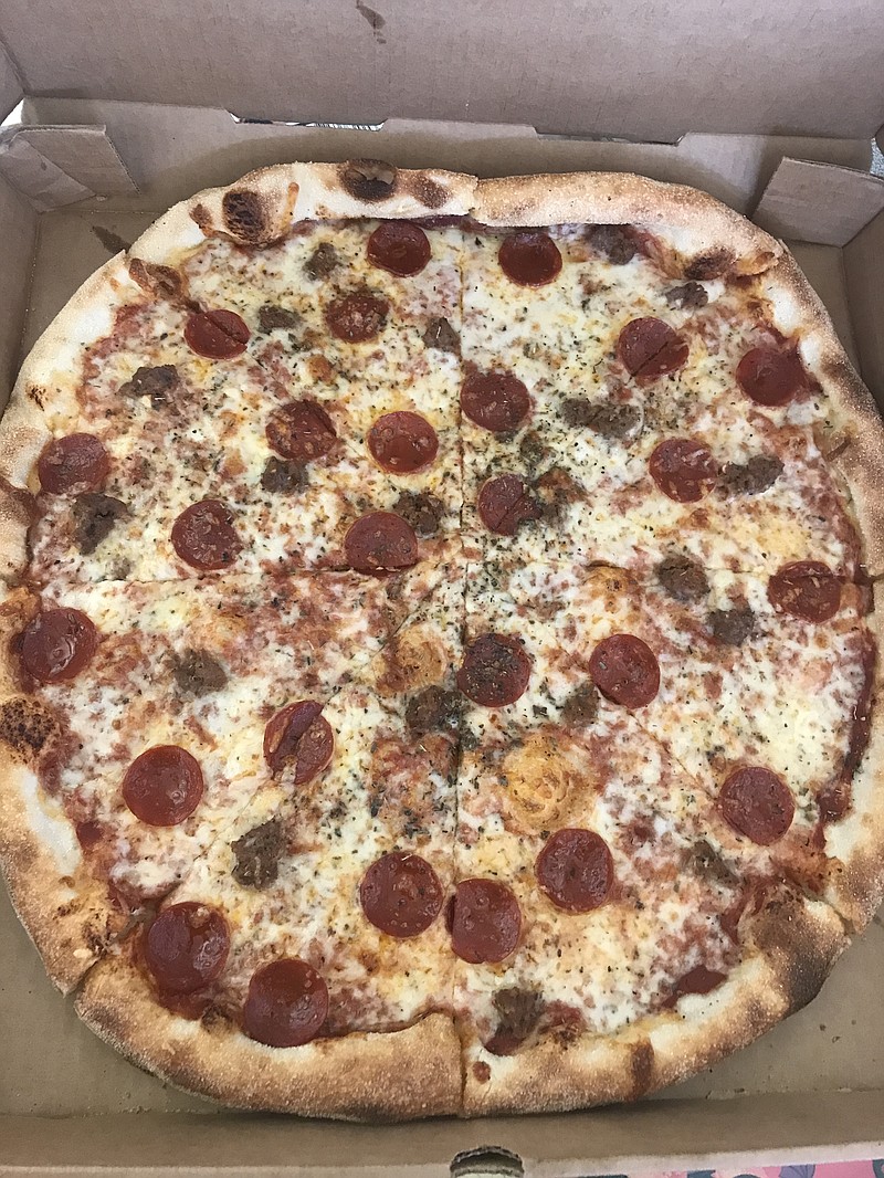 The New Yorker features tomato sauce, pepperoni, Italian sausage, Parmesan and oregano.