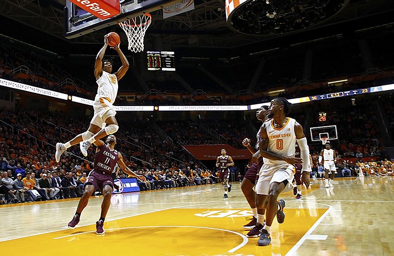 Tennessee forward Yves Pons goes for a dunk over Eastern Kentucky guard Jomaru Brown during Wednesday night's game in Knoxville.