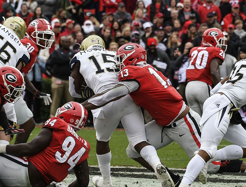 Georgia defensive end Jonathan Ledbetter (13), shown making a stop during last Saturday's home win against Georgia Tech, does not believe the Bulldogs will be intimidated by an Alabama team that has won each of its games this season by at least 22 points.