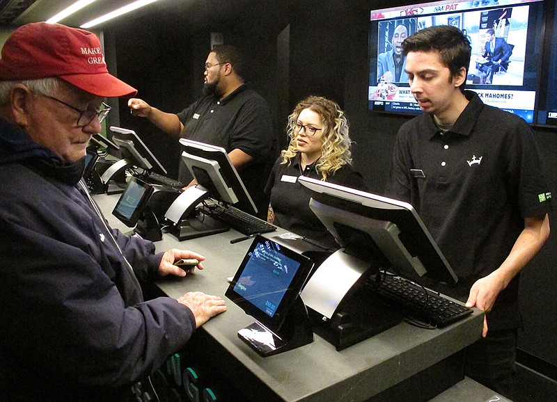 In this Nov. 20, 2018, photo a customer makes a sports bet at Resorts Casino in Atlantic City, N.J. Professional sports leagues that once vehemently fought sports betting are now partnering with gambling companies to get in on it now that it's legal. (AP Photo/Wayne Parry)

