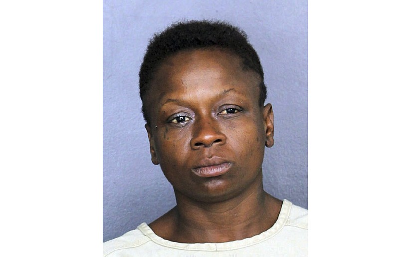 In this Nov. 25, 2018 photo, Shenetta Yvette Wilson is under arrest. Wilson faces an aggravated assault charge after authorities say she passed gas in line at a Dollar Store in Dania Beach, Fla., and pulled a knife on a man who complained about it. (Broward County Sheriff's Office via AP)