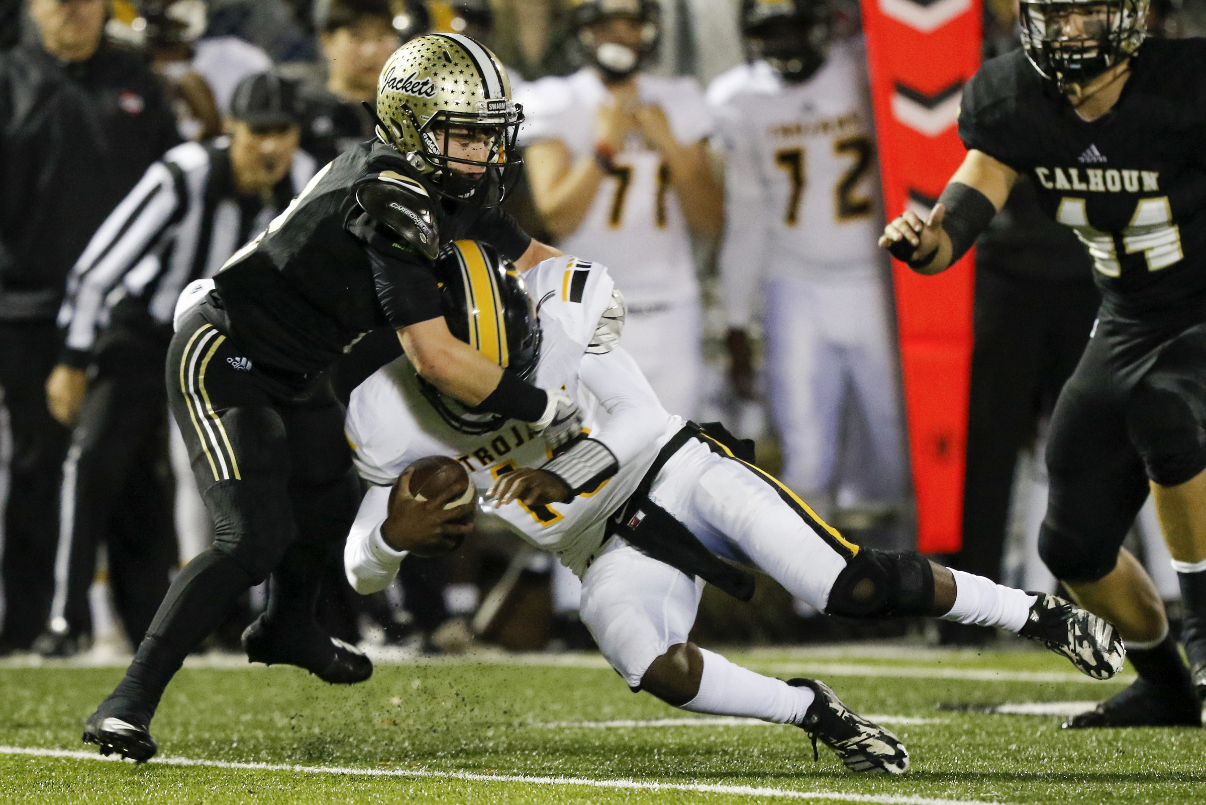 Calhoun's Payton Morrow (2) sacks Peach County's Jaydon Gibson (18) during the GHSA Class AAA semifinals at Phil Reeve Stadium on Friday, Nov. 30, 2018 in Calhoun, Ga.