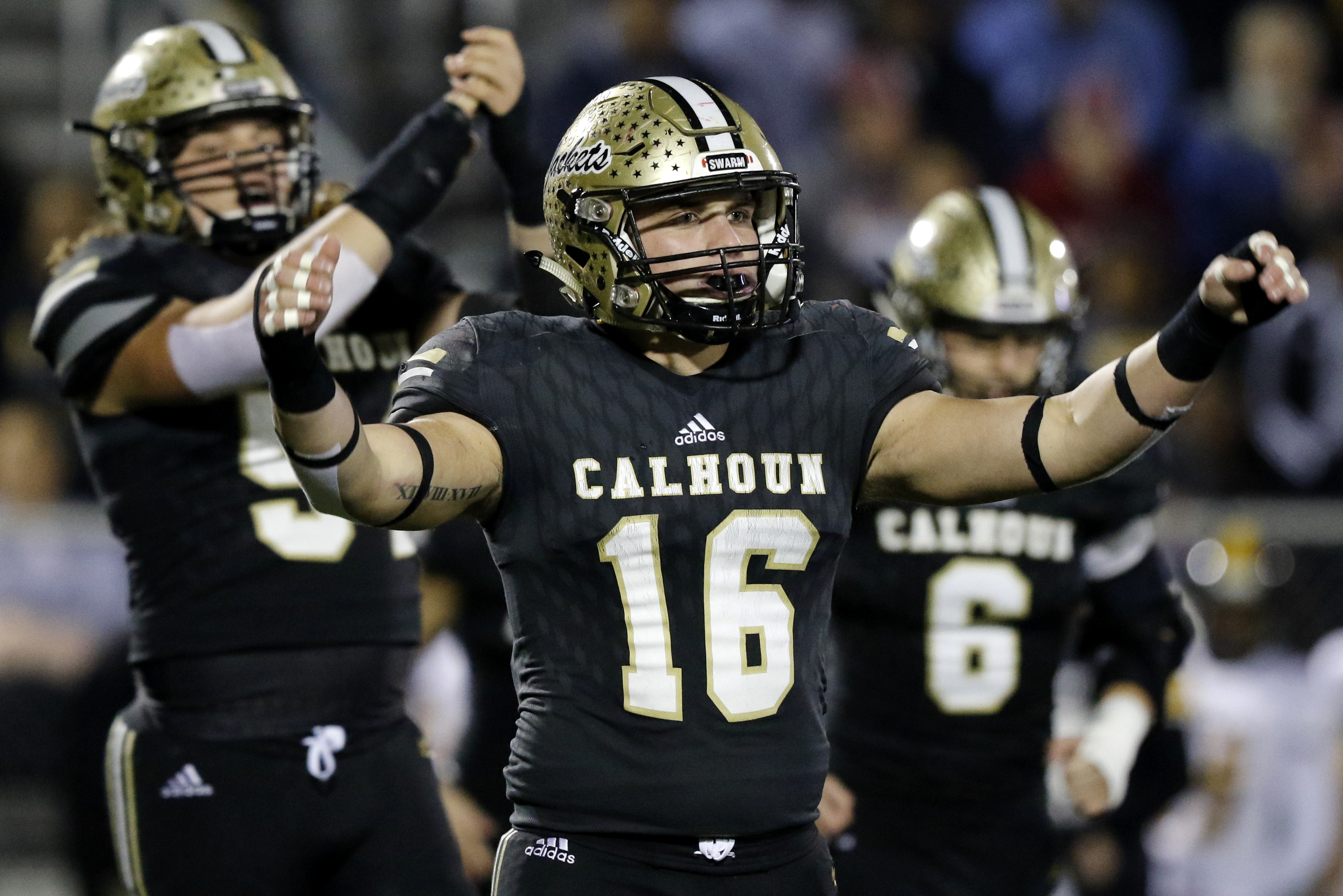 Calhoun's Collin Baggett (16) cheers after an early timeout by Peach County during the GHSA Class AAA semifinals at Phil Reeve Stadium on Friday, Nov. 30, 2018 in Calhoun, Ga.