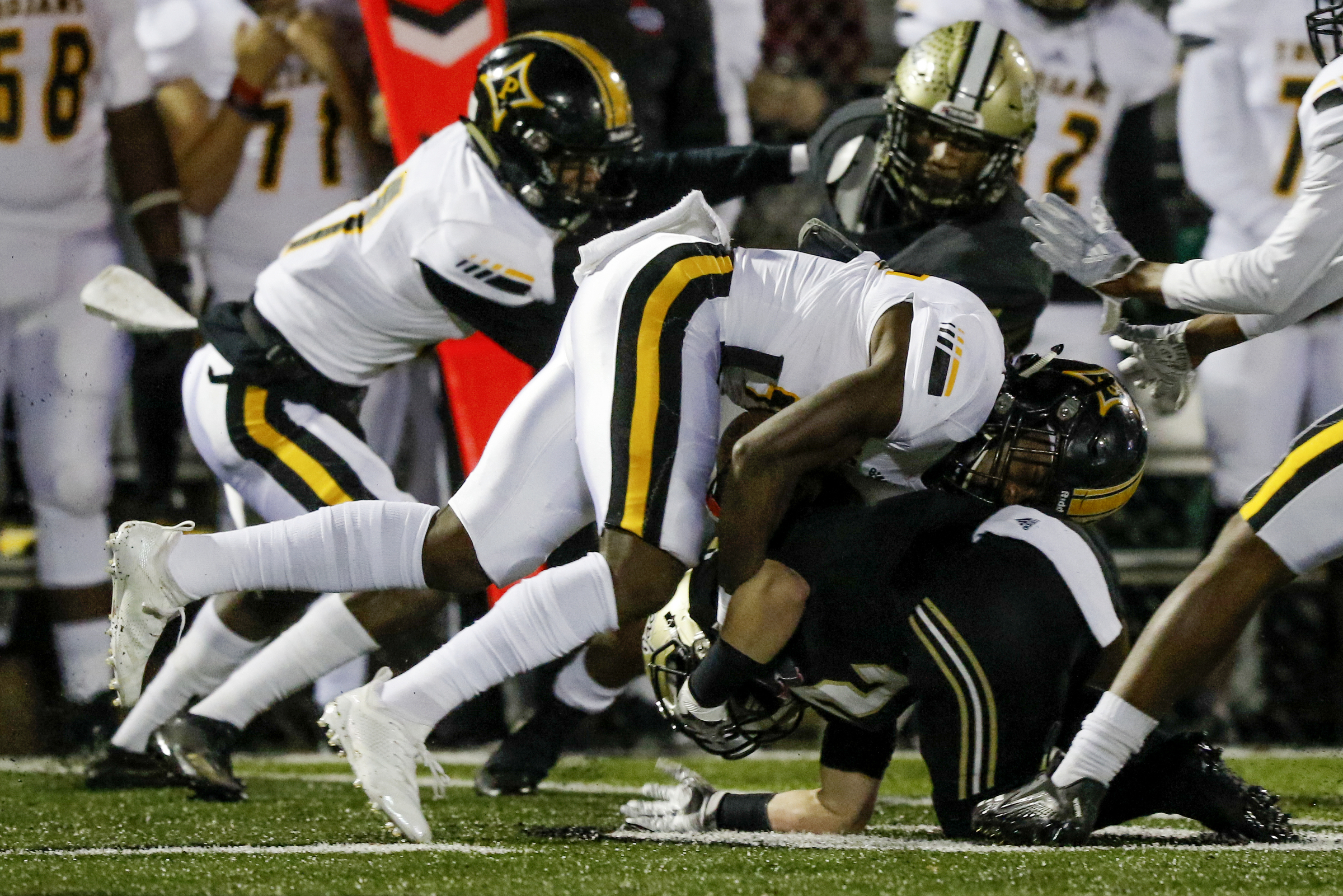 Calhoun's Payton Morrow (2) tackles Peach County's Noah Whittington (35) during the GHSA Class AAA semifinals at Phil Reeve Stadium on Friday, Nov. 30, 2018 in Calhoun, Ga.